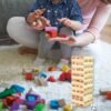 03_53cfa76d-53a3-4fe5-bd71-fdfce251e666 Wooden Tumbling Tower Game – 54 Numbered Blocks & Dice Set