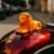 Lion Car Dashboard Toy – Majestic Orange-Gold Ornament with Adhesive Base