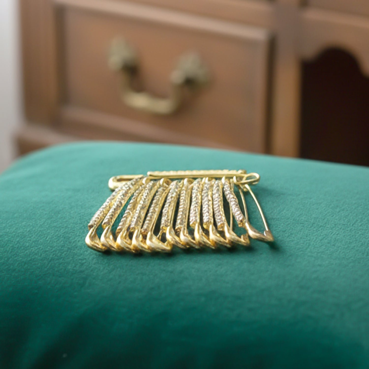 04_54a21ef9-6c32-4876-9606-c897baeed09f Golden Safety Pin Brooch Set – Elegant Stone-Embedded Design