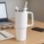 Stainless-Stee-Mug-0_b4122140-d4f9-481d-8bde-e9ccbbcb30f0 Insulated Stainless Steel Travel Tumbler – 890 ML White with Handle